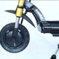 Close-up of a scooter's front wheel and suspension system on a white background